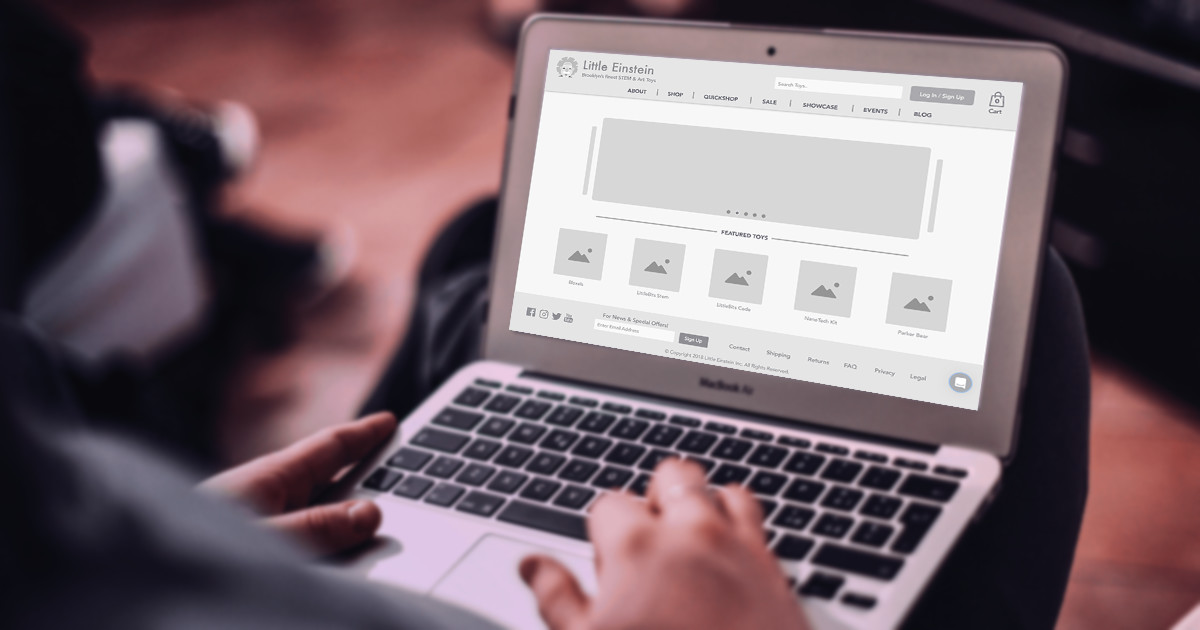 picture of laptop with website on screen